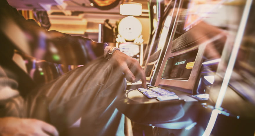 Gambler At A Slot Machine